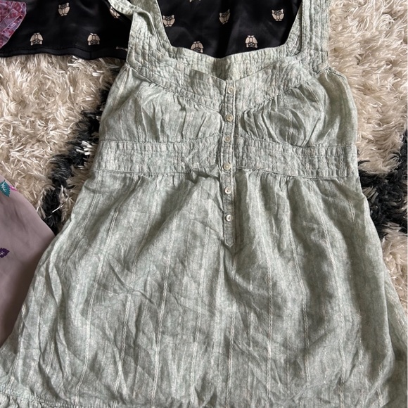 A shirt bundle with 5 tops (sizes include 1- XS, 3- smalls, and 1- medium) - Picture 8 of 11